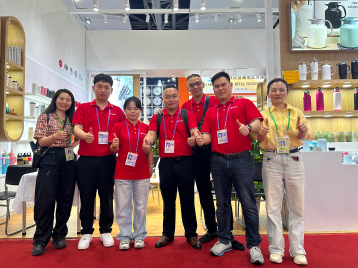 Group of people in red shirts giving thumbs - up