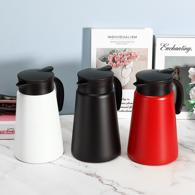 Three thermos jugs in white black and red