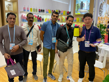 Group of people standing in a shop with products