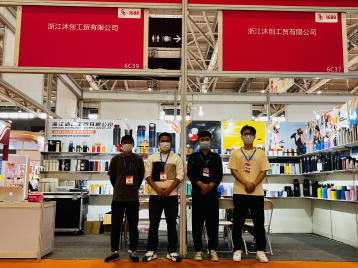 Four people standing in front of a booth