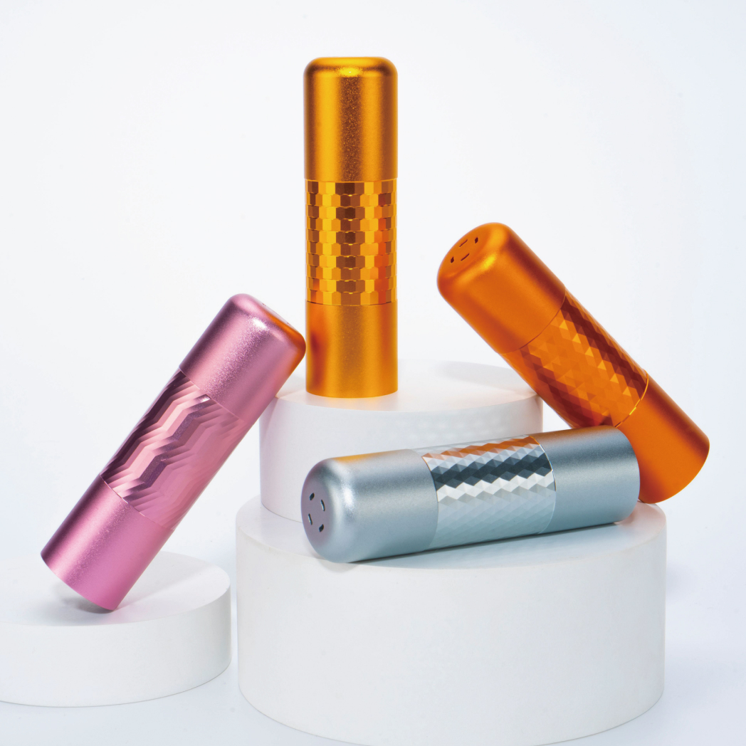 Four colorful cylindrical objects with textured patterns