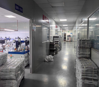 Industrial corridor with stacked packages and equipment