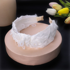 Wholesale custom fashionable round hollow star solid color fabric hairband for women
