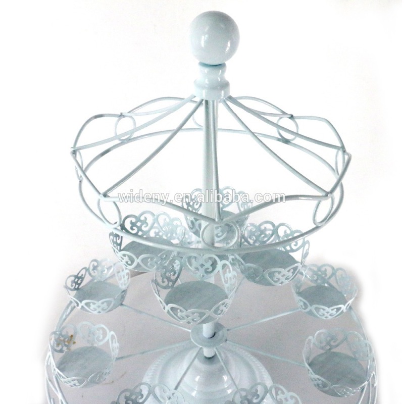 Revolving white metal fountain wedding cake stand