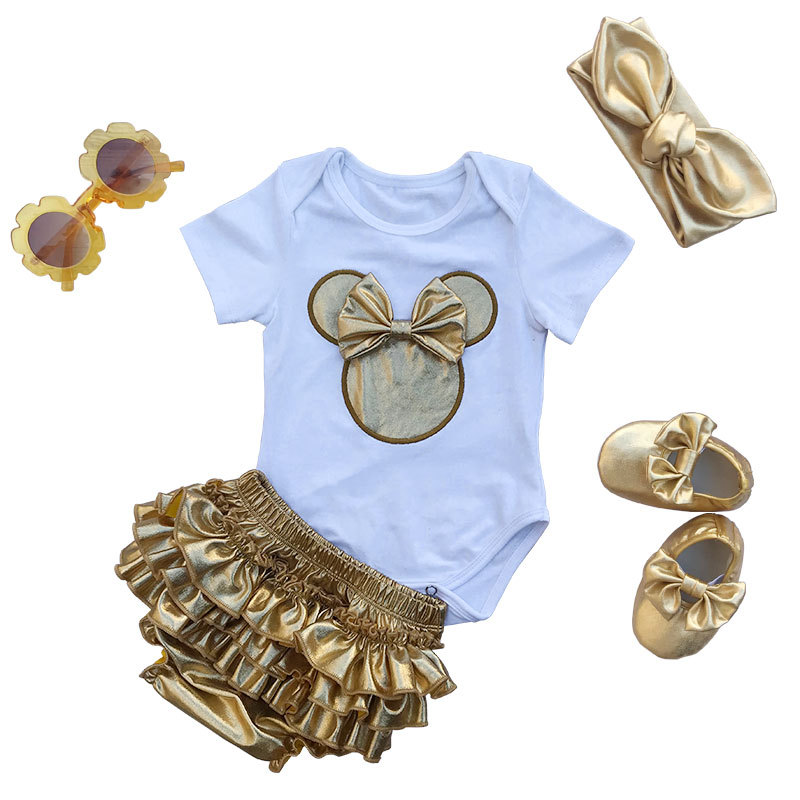 Little Girl Mini Romper Outfit Set With Gold Diaper Cover And Headband As Well As Baby Shoes