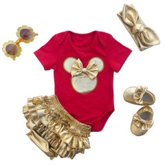 Little Girl Mini Romper Outfit Set With Gold Diaper Cover And Headband As Well As Baby Shoes