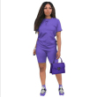 Purple purse and jumpsuit