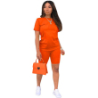 Orange purse and jumpsuit
