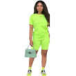Green purse and jumpsuit