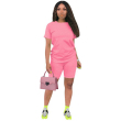 Pink purse and jumpsuit