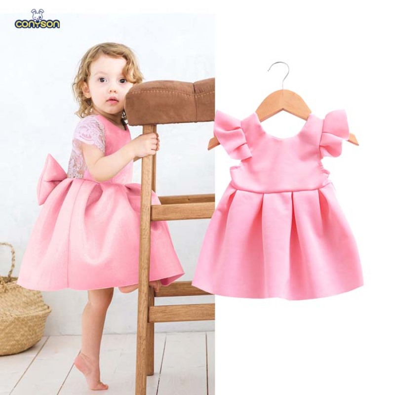 Vestido de festa infantil Conyson Wholesale com renda, sem mangas, para aniversário ou baile de formatura. Vestido de princesa rosa com decote nas costas e laço grande.