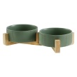 two green bowl with woodern