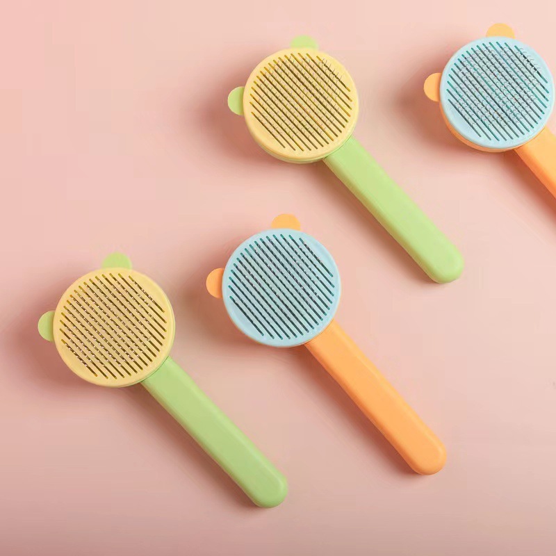 Manufacturer wholesale one button remove yellow green cheap dog cat comb