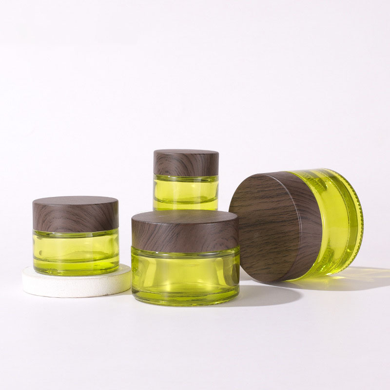 Elegant Cosmetic Jars Glass Container Wooden Transfer Printing Lids 50g