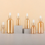 Wholesale Golden Glass Dropper Bottles 5ml 10ml 15ml 30ml 50ml 100ml Essential Oil Packaging with Matte Gold Cap
