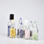 Clear 50ml Essential Oil Roll-on Perfume Bottle Glass Deodorant Vial with Colorful Stones MOQ 100pcs