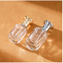 Unique Design Transparent Glass Perfume Bottle 30ml 50ml Gold Silver Black Sprayer with Round Metallic Cap