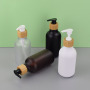 Frosted 300ml Lotion Bottle Luxury 500ml Skincare Packaging Shampoo Bottle Plastic Wood Pump PET Hair Oil Lotion Pump Bottle