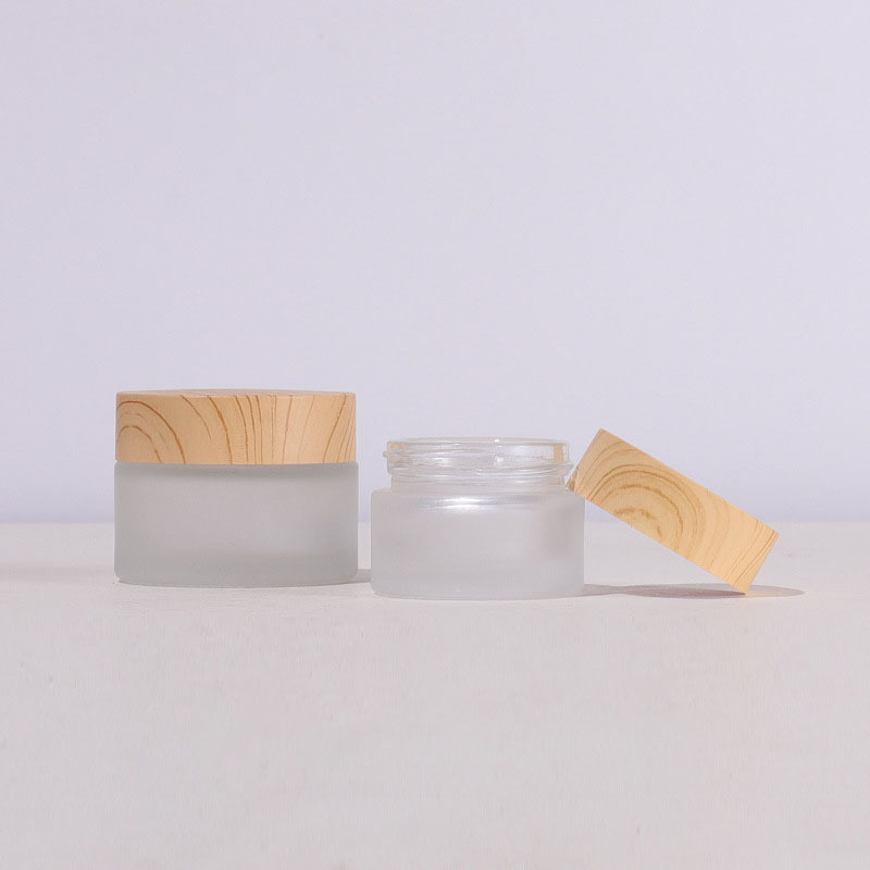 Custom Label Round Glass Jar 50g Cosmetic Packaging with Wooden Color Lid Frosted Glass Cosmetic Cream Jar