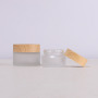 Custom Label Round Glass Jar 50g Cosmetic Packaging with Wooden Color Lid Frosted Glass Cosmetic Cream Jar