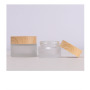 Custom Label Round Glass Jar 50g Cosmetic Packaging with Wooden Color Lid Frosted Glass Cosmetic Cream Jar