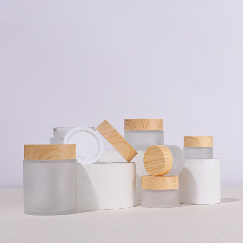 Custom Label Round Glass Jar 50g Cosmetic Packaging with Wooden Color Lid Frosted Glass Cosmetic Cream Jar