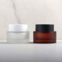 Wholesale Amber 50g Glass Cosmetic Frosted Jar for Creams and Balms Skincare Packaging with Black Lid