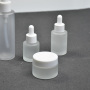 Skincare Set Eco-Friendly Flat Empty Packaging 50g Cream Jar Glass Frosted 30ml Essential Oil Bottle 100ml Lotion Pump Bottles