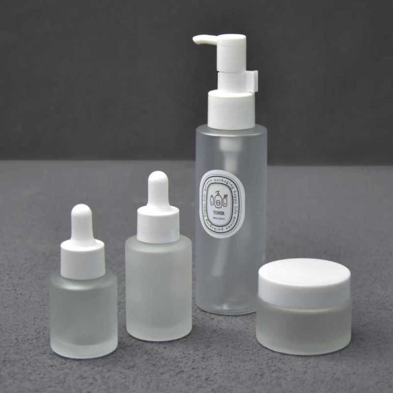 Skincare Set Eco-Friendly Flat Empty Packaging 50g Cream Jar Glass Frosted 30ml Essential Oil Bottle 100ml Lotion Pump Bottles