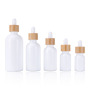 Hot Selling 15ml 30ml 50ml 100ml Empty Essential Oil Glass Dropper Bottle With Bamboo Lids