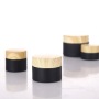 Wholesale High Quality 10g 20g 30g 50g Matte Black Clear Frosted Flat Round Glass Jars With Wooden Grain Plastic Lid