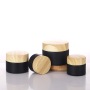 Wholesale High Quality 10g 20g 30g 50g Matte Black Clear Frosted Flat Round Glass Jars With Wooden Grain Plastic Lid