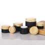 Wholesale High Quality 10g 20g 30g 50g Matte Black Clear Frosted Flat Round Glass Jars With Wooden Grain Plastic Lid