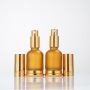 Customized 30ml Luxury Fashion Frosted Glass Perfume Bottle with Gold Cap Concave Convex Design Cylinder Shape