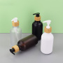 Matte Black 300ml PET Plastic Hotel Hair Shampoo Bottle with Wooden Color Pump Minimum Order Quantity 100pcs