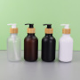 Matte Black 300ml PET Plastic Hotel Hair Shampoo Bottle with Wooden Color Pump Minimum Order Quantity 100pcs