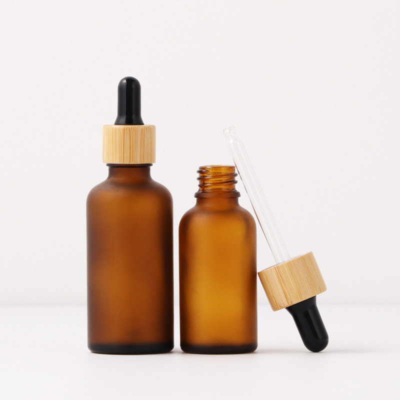 Guangzhou 2025 New Year Gift Bottles 60ml 2 oz Amber Frosted Round Glass Cosmetic Essential Oil Serum Dropper Bottle with Box