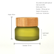 olive green glass jar with bamboo lid