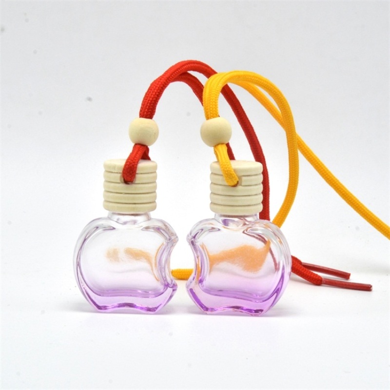 Yiwu Wholesale Price Clear Round Hanging Bottle 5ml 8ml Empty for Car Perfume with Colorful Rope Crown Cap Wood Cap Included