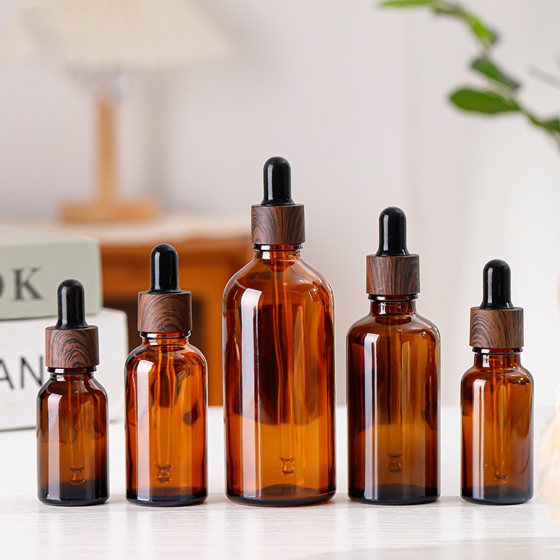 Wholesale Empty Cosmetic Amber Glass Body Oil 15ml 20ml 30ml Dropper Bottle with Wooden Grain Cap