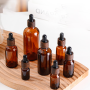 Wholesale Empty Cosmetic Amber Glass Body Oil 15ml 20ml 30ml Dropper Bottle with Wooden Grain Cap