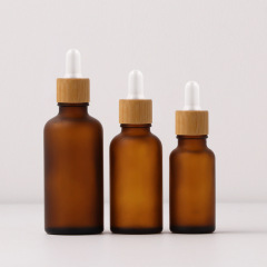 Yiwu 2025 New Year Gift 60ml 2 oz Amber Frosted Round Glass Dropper Bottle Cosmetic Essential Oil Empty Packaging 30ml Volume