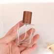 Clear bottle with  Walnut Cap