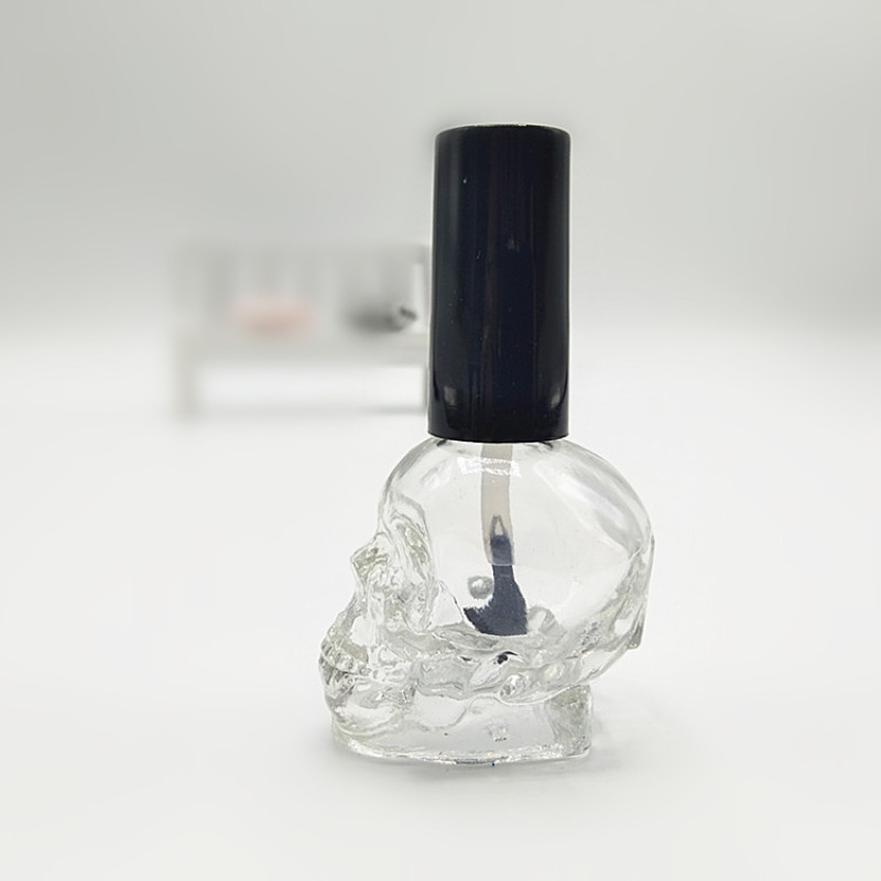 Luxury 10ml Clear Glass Nail Polish Bottles Empty Skull Shape with Integrated Brush for Nail Polish Oil Packaging