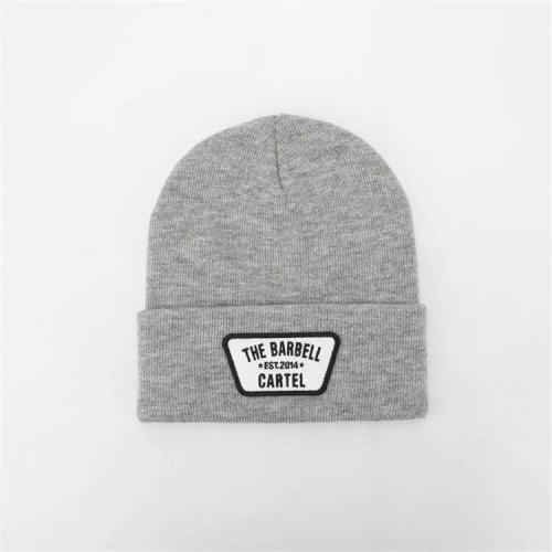 Custom design embroidered patch logo high quality neutral cuffs plain Skull Hat knitted acrylic Winter Hat fisherman casual hat