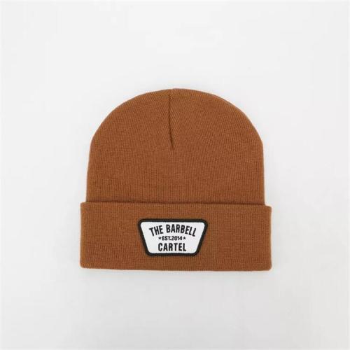 Custom design embroidered patch logo high quality neutral cuffs plain Skull Hat knitted acrylic Winter Hat fisherman casual hat