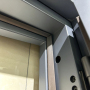 Modern Minimalist Pivot Exterior Steel Door with Geometric Line Pattern for Villa Entrance