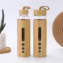 New Creative 550ml Premium Eco-friendly Bamboo Shell Crystal High Boro silicate Glass Water Bottle With Bamboo Sleeve Rope Handle