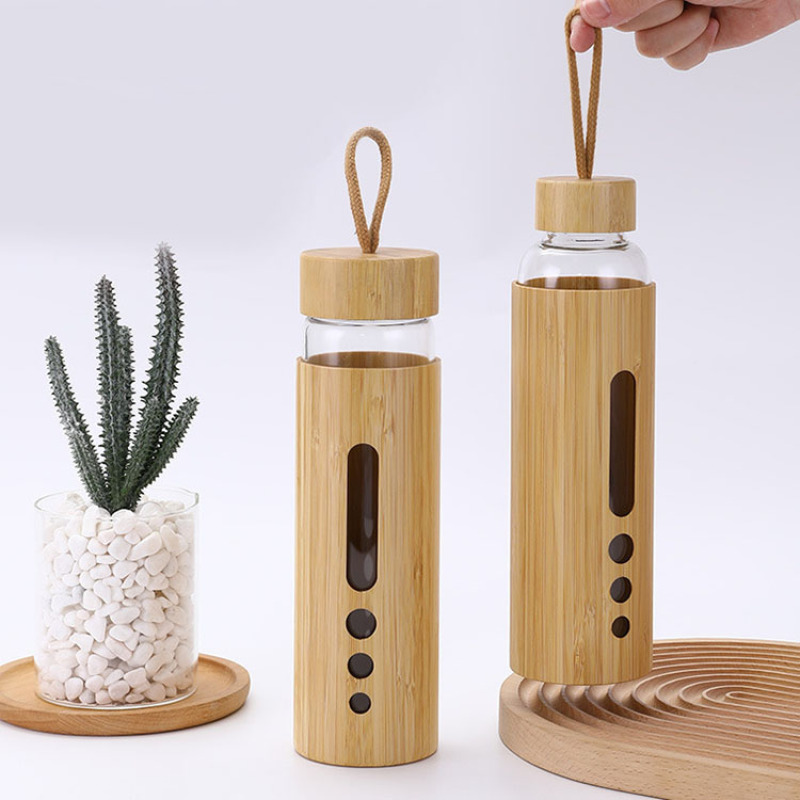 New Creative 550ml Premium Eco-friendly Bamboo Shell Crystal High Boro silicate Glass Water Bottle With Bamboo Sleeve Rope Handle