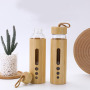 New Creative 550ml Premium Eco-friendly Bamboo Shell Crystal High Boro silicate Glass Water Bottle With Bamboo Sleeve Rope Handle